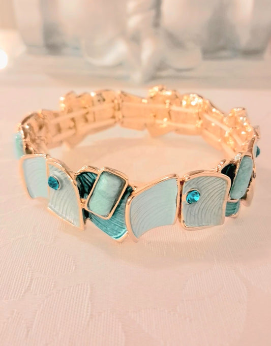 Bracciale smaltato in acciaio dorato