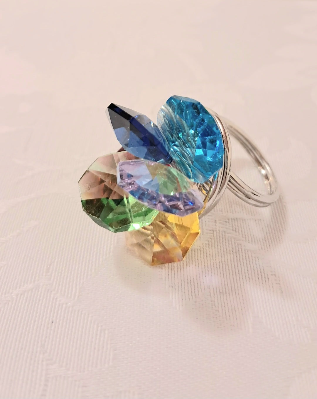 Anello ciuffo multicolor in acciaio