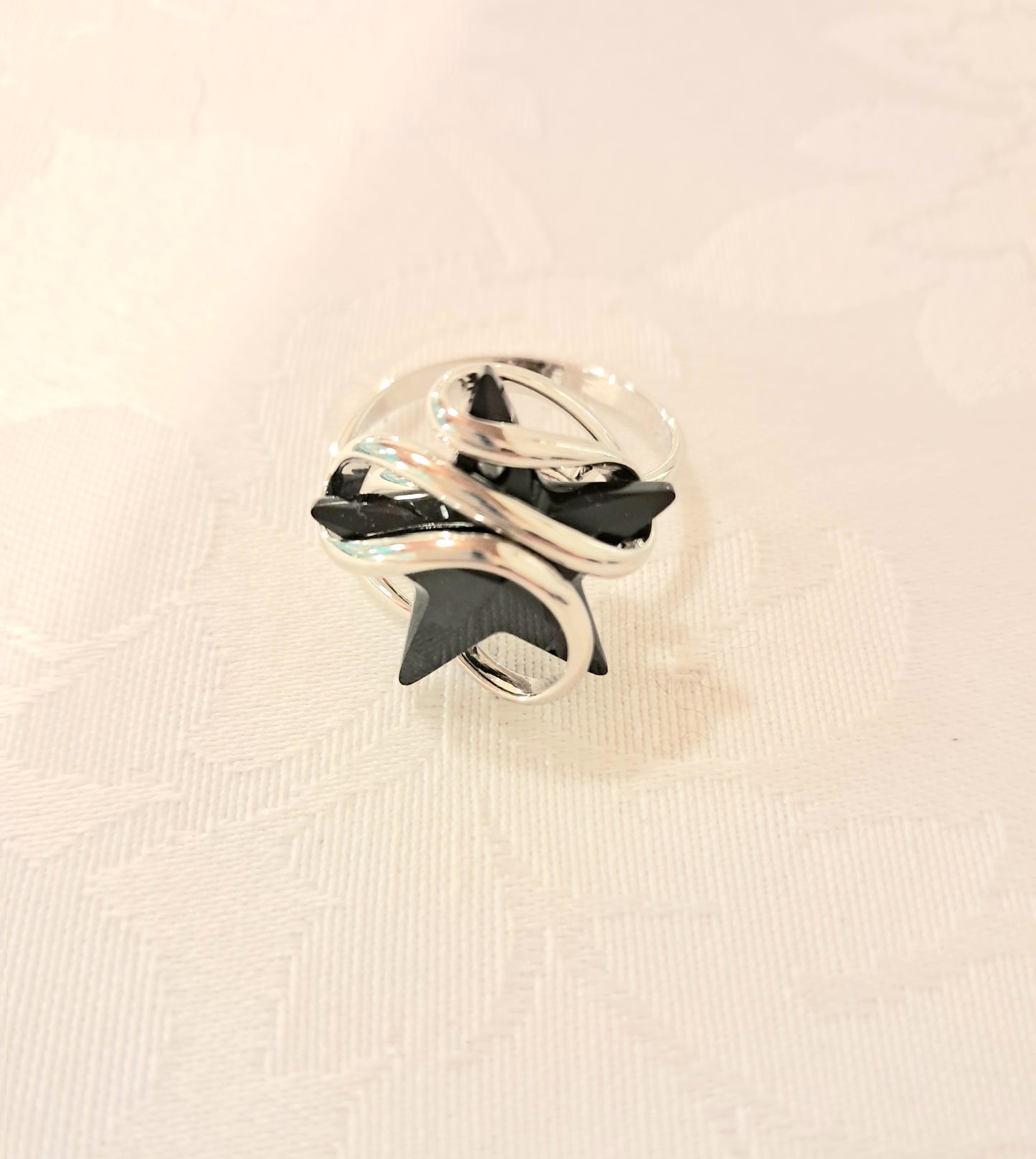Anello stellina nera acciaio
